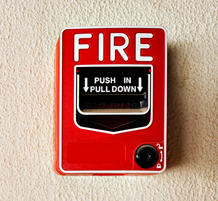 Fire alarm pull station on a commercial wall
