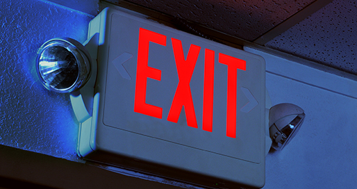 Illuminated EXIT sign with emergency lighting heads