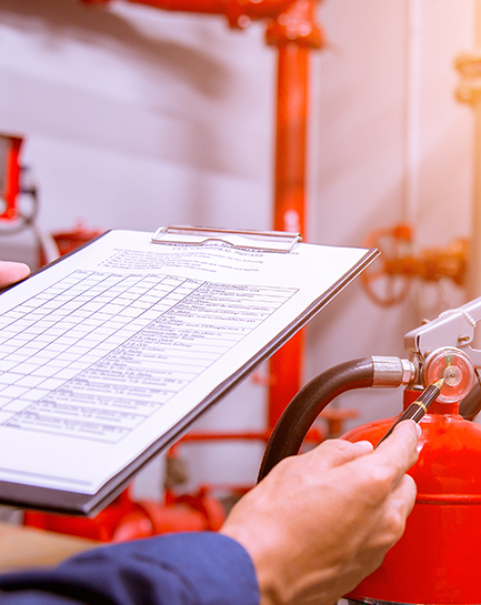 FireServ technician documenting a fire extinguisher inspection